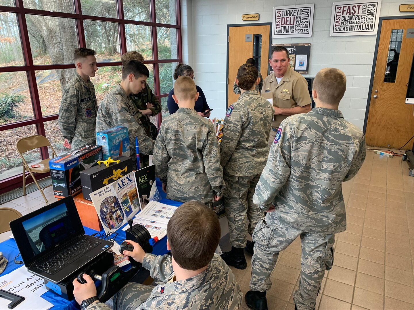 IMAGE: SPOTSYLVANIA, Va. (Feb. 29, 2020) – Capt. Casey Plew, Naval Surface Warfare Center Dahlgren Division (NSWCDD) commanding officer, speaks with students who are cadets in the Virginia Wing Civil Air Patrol at the annual science, technology, engineering, mathematics (STEM) Summit open to the public at Chancellor High School. Plew was among the NSWCDD leaders, scientists and engineers who joined a myriad of organizations to engage students with science, technology, engineering, mathematics (STEM) demonstrations. “For Patriots ages 12 and up, Civil Air Patrol is a vital force that protects Americans in need by responding to disaster, preserves the values that make our country great by developing young leaders and ensures our country's preeminence in Aerospace and Cyberspace Education,” states the organization’s website.