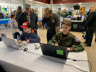 IMAGE: SPOTSYLVANIA, Va. (Feb. 29, 2020) – JD Chaudhry, a Naval Surface Warfare Center Dahlgren Division (NSWCDD) scientist, shares STEM (science, technology, engineering, mathematics) advice with students at the annual science, technology, engineering, mathematics STEM Summit hosted by Chancellor High School. Chaudhry was among the NSWCDD leaders, scientists and engineers who joined a myriad of organizations to engage students with STEM technologies and demonstrations.  (U.S. Navy photo/Released)