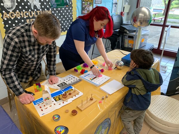 IMAGE: SPOTSYLVANIA, Va. (Feb. 29, 2020) – Science, technology, engineering, mathematics (STEM) mentors from Naval Surface Warfare Center Dahlgren Division (NSWCDD)  use Soma blocks to pique an elementary school student’s interest in STEM at the annual science, technology, engineering, mathematics (STEM) Summit hosted by Chancellor High School. They were among the NSWCDD leaders, scientists and engineers who joined a myriad of organizations to engage students with STEM technologies and demonstrations. (U.S. Navy photo/Released)