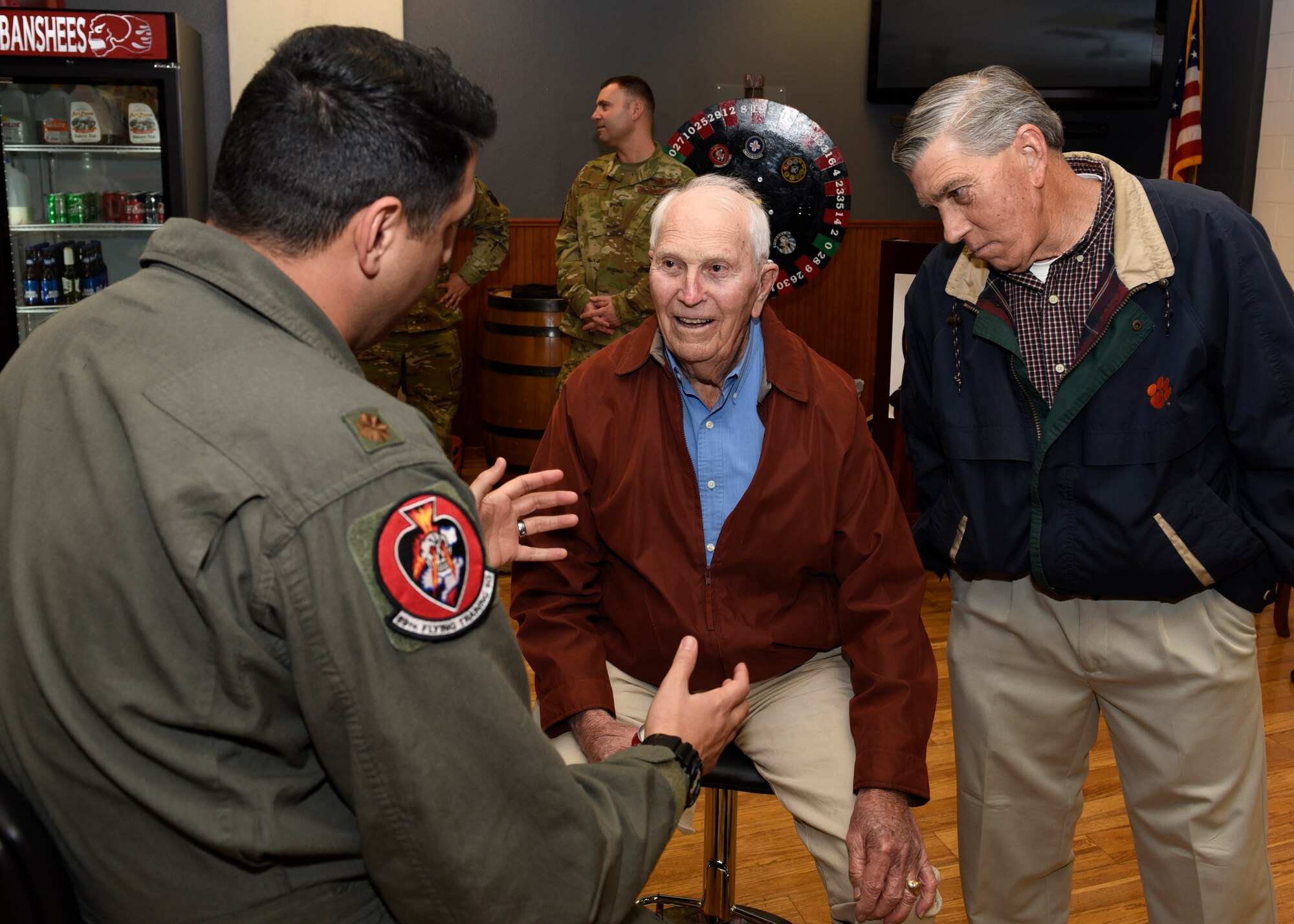 A 80th Flying Training Wing pilot talks war stories with retired Army Capt. Joe Jones and his son, Jim Jones, at Sheppard Air Force Base, Texas, Feb. 28, 2020. Jones fought in the European theater of World War II. Jones was the leader of a rifle platoon and later a weapons platoon (three light machine guns and three mortars.) Jones served under Gen. George Patton in his Third Army and saw battle in France, Germany and Austria. He returned home in July 1946. (U.S. Air Force photo by Senior Airman Pedro Tenorio)