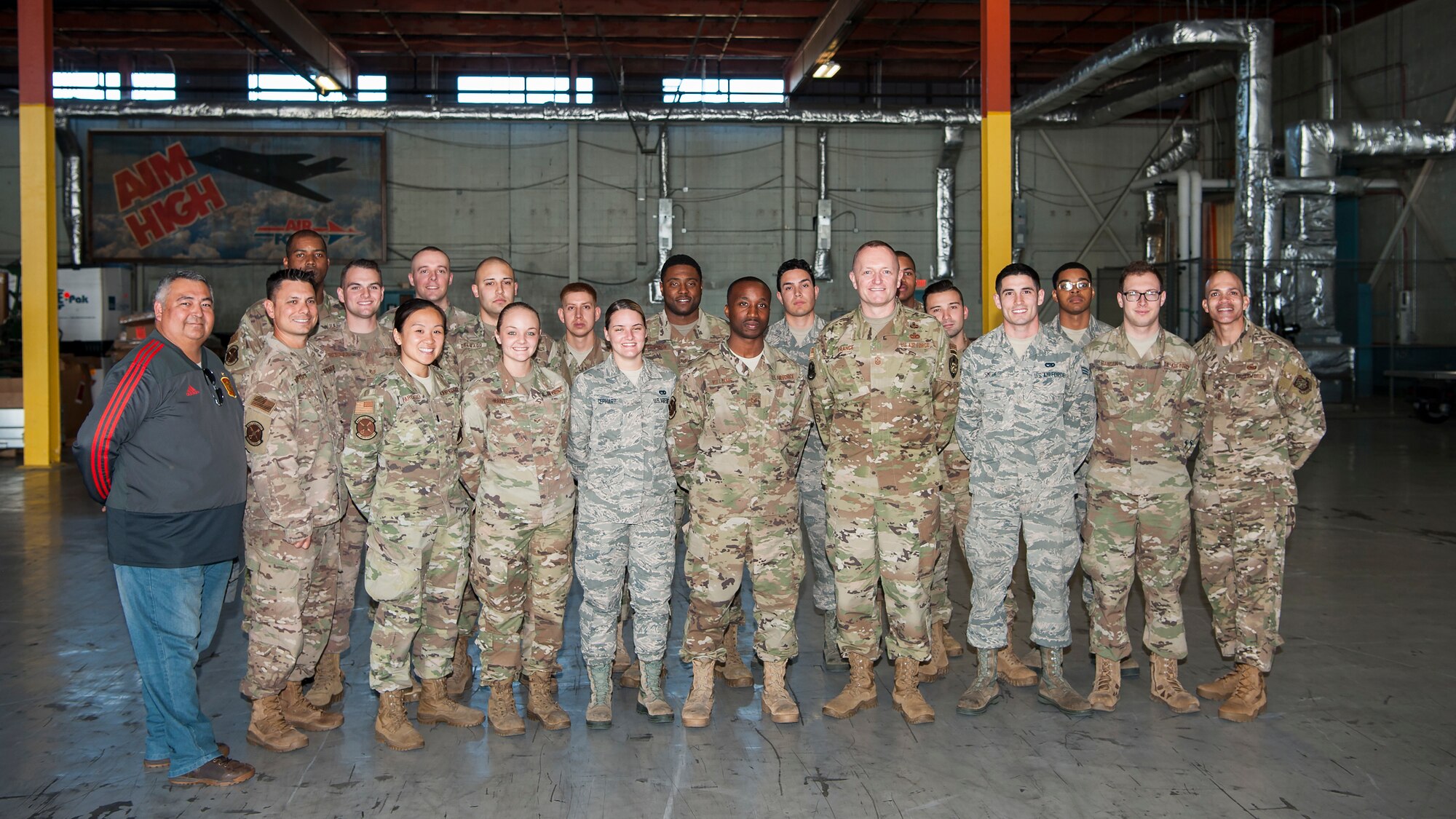 U.S. Air Force Airmen from the 6th Logistics Readiness Squadron pause for a photo with Chief Master Sgt. Jason France, the command senior enlisted leader at U.S. Transportation Command, Scott Air Force Base, Ill., at MacDill Air Force Base, Fla., Feb. 27, 2020.