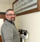 Photo of Matthew DeHart completing the challenge mid-point weigh in