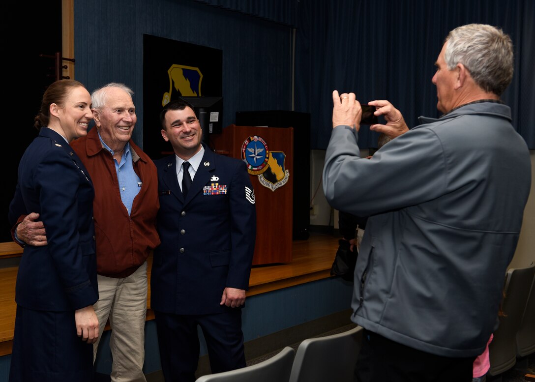 From left, Lt. Col Elia Hickie, retired Army Capt. Joe Jones and Tech. Sgt. Joe Jones, pose while Ken Jones takes a photo at Sheppard Air Force Base, Texas, Feb. 28, 2020. This was Jones' family's first time seeing him promote since basic training. To become a Tech. Sgt., not only must you be proficient and have a craftsman skill level in your career field, there are multiple Air Force standard tests you must score well on. Not to mention competing with every other Staff Sgt. looking to promote as well. (U.S. Air Force photo by Senior Airman Pedro Tenorio)