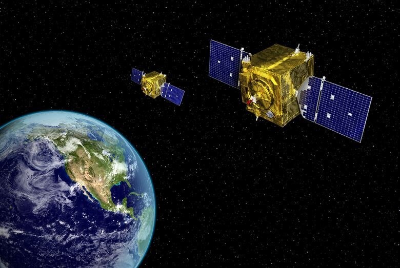 An artistic rendering shows two Geosynchronous Space Situational Awareness Program satellites orbiting Earth. The GSSAP ground system completed an upgrade in December and exited an operational acceptance trial period on 12 February. (Graphic courtesy of U.S. Air Force)