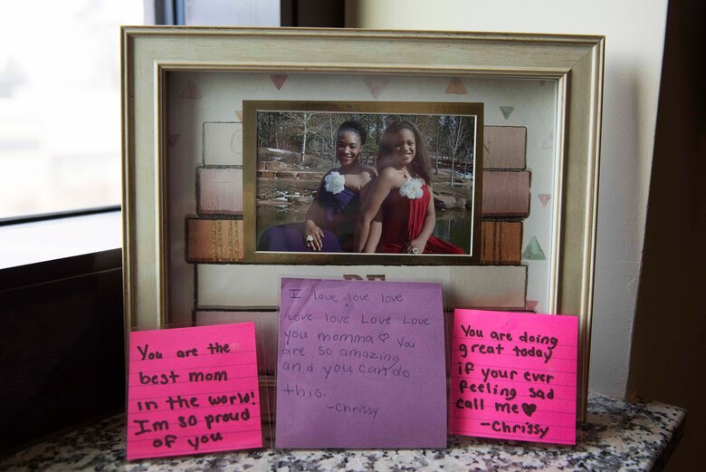 A framed picture shows U.S. Air Force Master Sgt. Debbie Jackson, 39th Air Base Wing career assistance advisor, (left), posing with her daughter, Chrissy, Feb. 21, 2020, at Incirlik Air Base, Turkey. Jackson gave up her daughter for adoption, but was still able to participate in raising her through the approval of Chrissy’s adoptive parents. (U.S. Air Force photo by Staff Sgt. Joshua Magbanua)