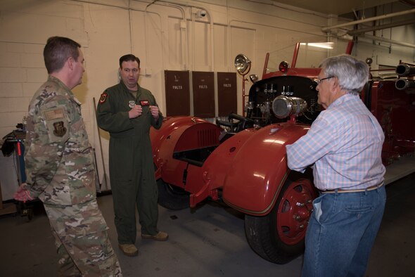 U.S. Air Force Lt. Col. Chad Harris, center, 60th Air Mobility Wing curator, and Enrigue Ugalde, right, 60th AMW heritage center volunteer, show Col. Jeffrey Nelson, 60th AMW commander, a Seagraves fire truck from 1942 during Leadership Rounds Feb. 28, 2020, at Travis Air Force Base, California. The Leadership Rounds program provides 60th AMW leadership an opportunity to interact with members of Team Travis and get a detailed view of each mission performed on base. (U.S. Air Force photo by Airman 1st Class Cameron Otte)