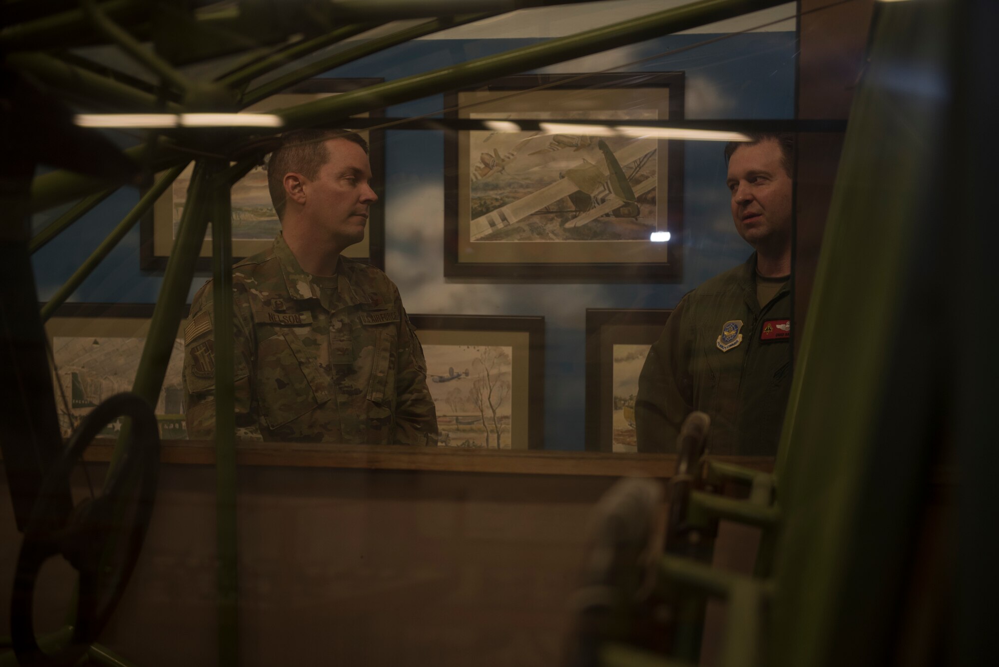 U.S. Air Force Lt. Col. Chad Harris, right, 60th Air Mobility Wing curator, shows Col. Jeffrey Nelson, 60th Air Mobility Wing commander, a CG-4 Hadrian Glider cockpit during Leadership Rounds Feb. 28, 2020, at Travis Air Force Base, California. The Leadership Rounds program provides 60th AMW leadership an opportunity to interact with members of Team Travis and get a detailed view of each mission performed on base. (U.S. Air Force photo by Airman 1st Class Cameron Otte)