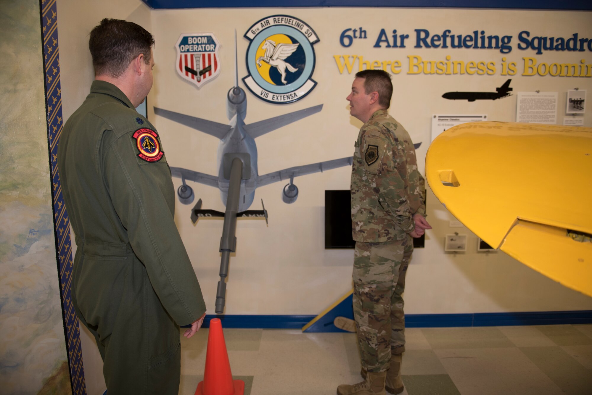 U.S. Air Force Lt. Col. Chad Harris, left, 60th Air Mobility Wing curator, shows Col. Jeffrey Nelson, right, 60th AMW commander, the 6th Air Refueling Squadron heritage display during Leadership Rounds Feb. 28, 2020, at Travis Air Force Base, California. The Leadership Rounds program provides 60th AMW leadership an opportunity to interact with members of Team Travis and get a detailed view of each mission performed on base. (U.S. Air Force photo by Airman 1st Class Cameron Otte)