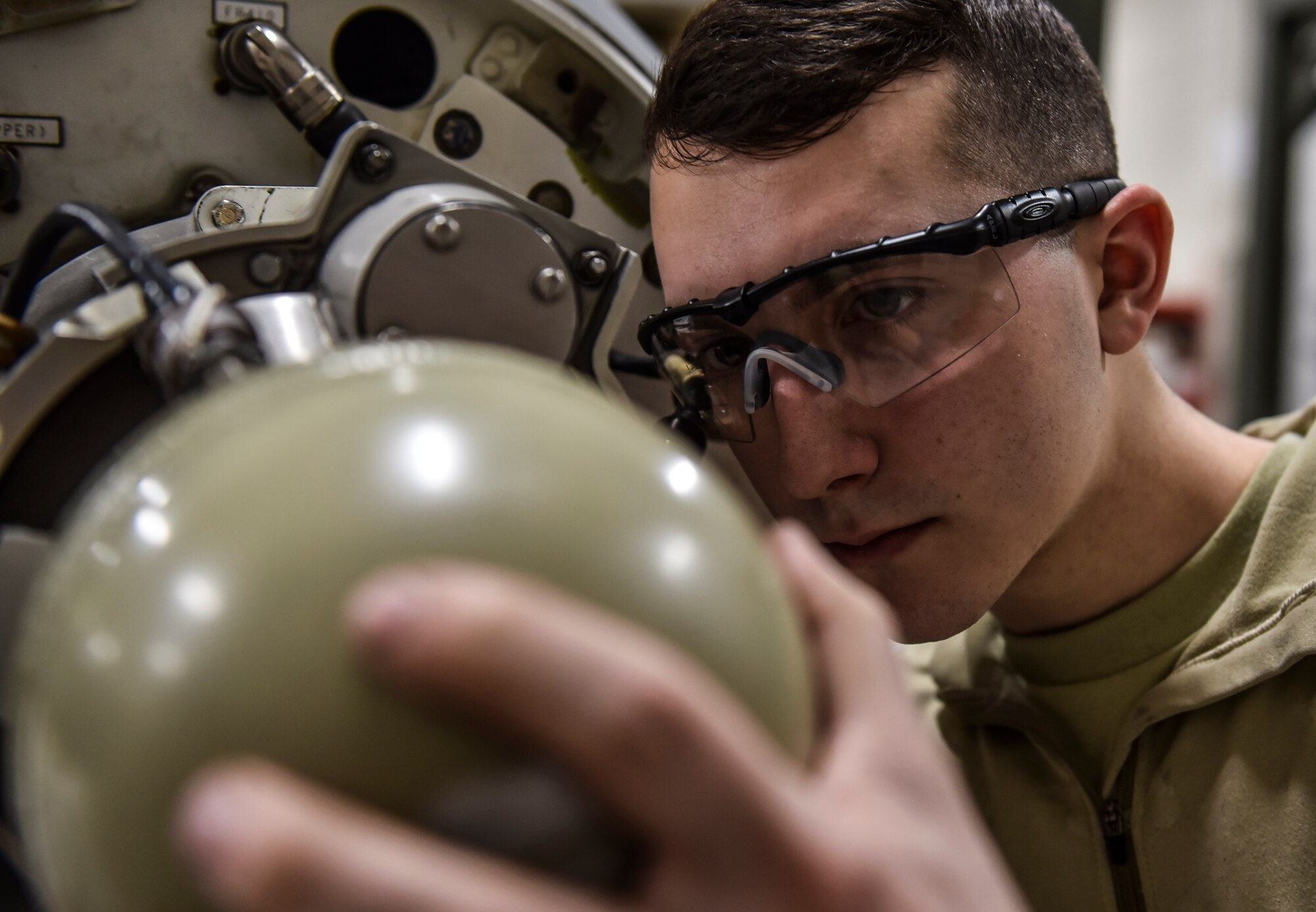 U.S. Air Force Airman 1st Class Kullen Fuller, 92nd Maintenance Squadron aircraft hydraulic systems journeyman, remove the front cone of a boom pod, Feb. 27, 2020, at Fairchild Air Force Base, Washington.