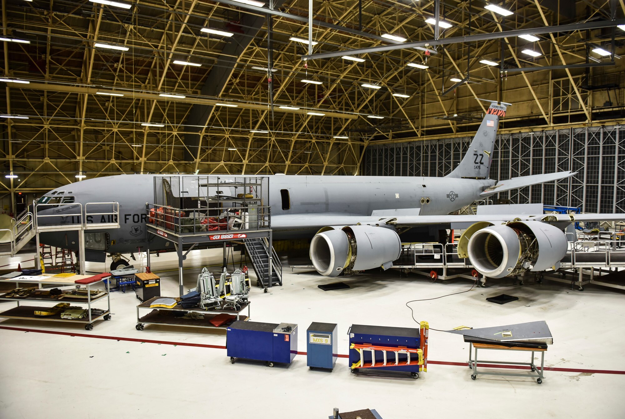 A KC-135 Stratoanker sits in a hangar as Airmen from the 92nd Maintenance Squadron perform maintenance on it Feb. 27, 2020, at Fairchild Air Force Base, Washington.