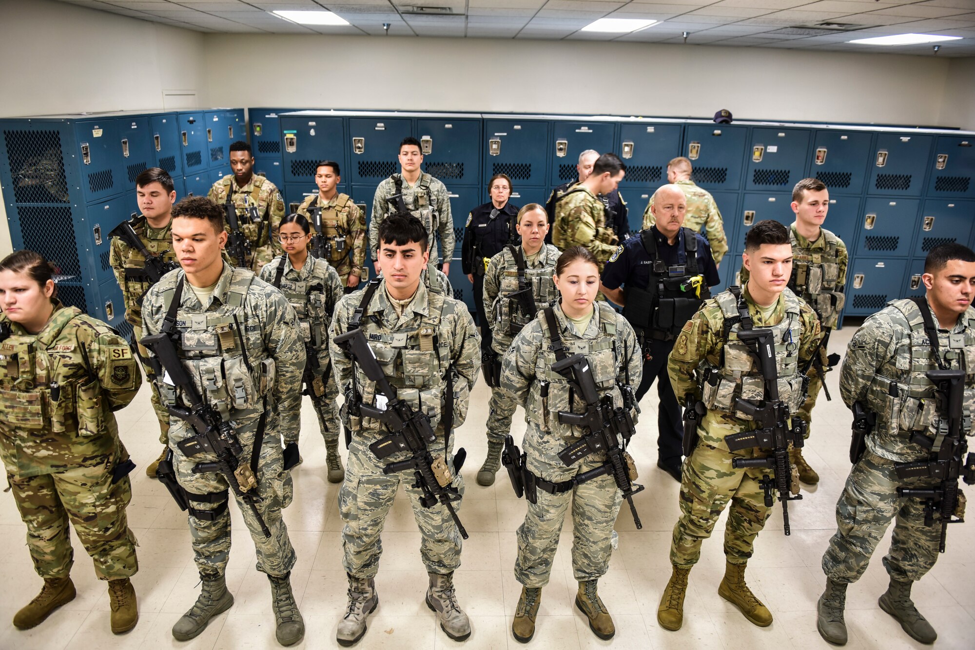 Members of the 92nd Security Forces Squadron perform a uniform and gear inspection before beginning their shift Feb. 27, 2020, at Fairchild Air Force Base, Washington.