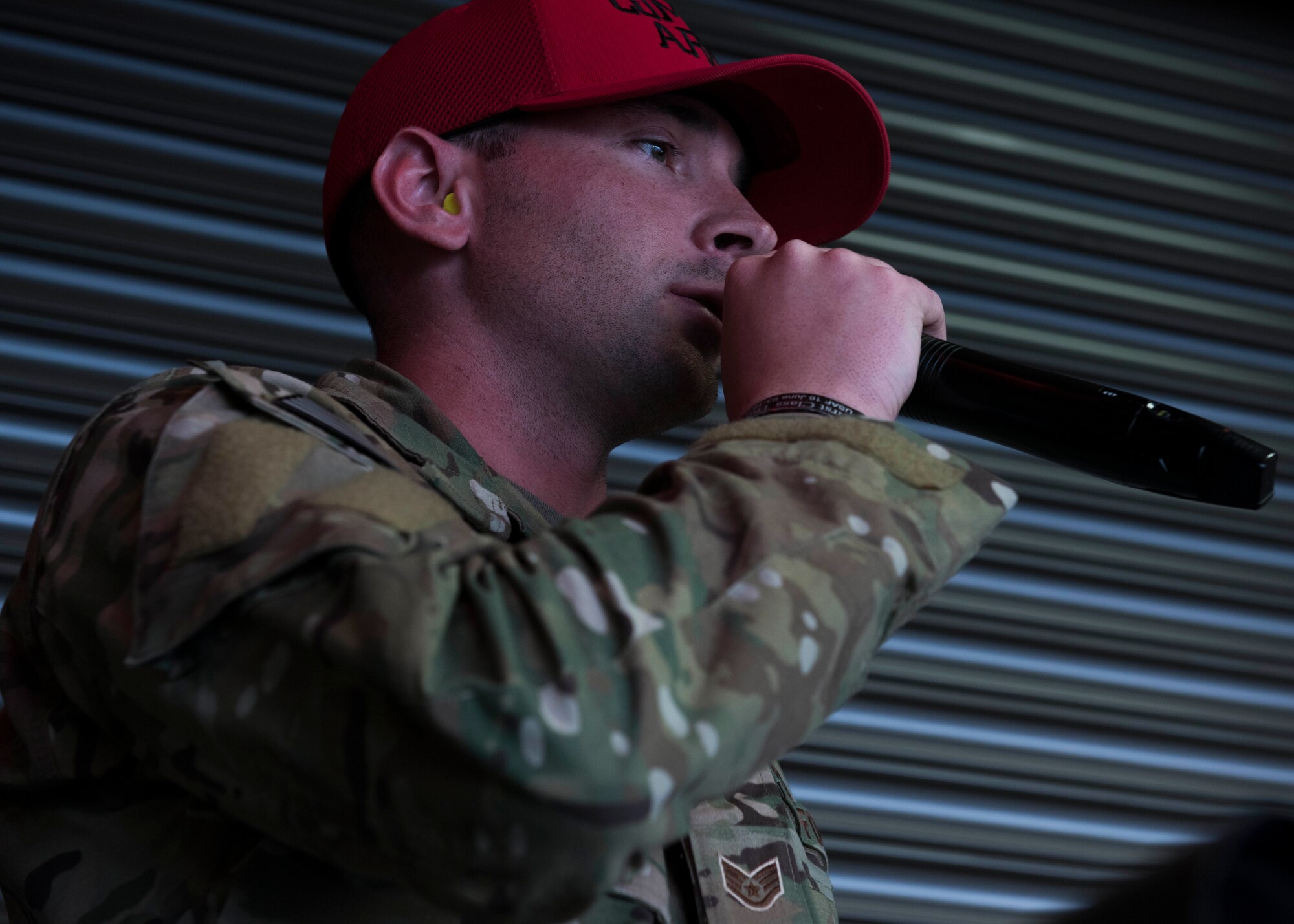 U.S. Air Force Staff Sgt. Justin Burback, 92nd Security Forces Squadron Combat Arms Training instructor, conducts a firearm qualification course at Fairchild Air Force Base, Washington, Feb. 27, 2020.