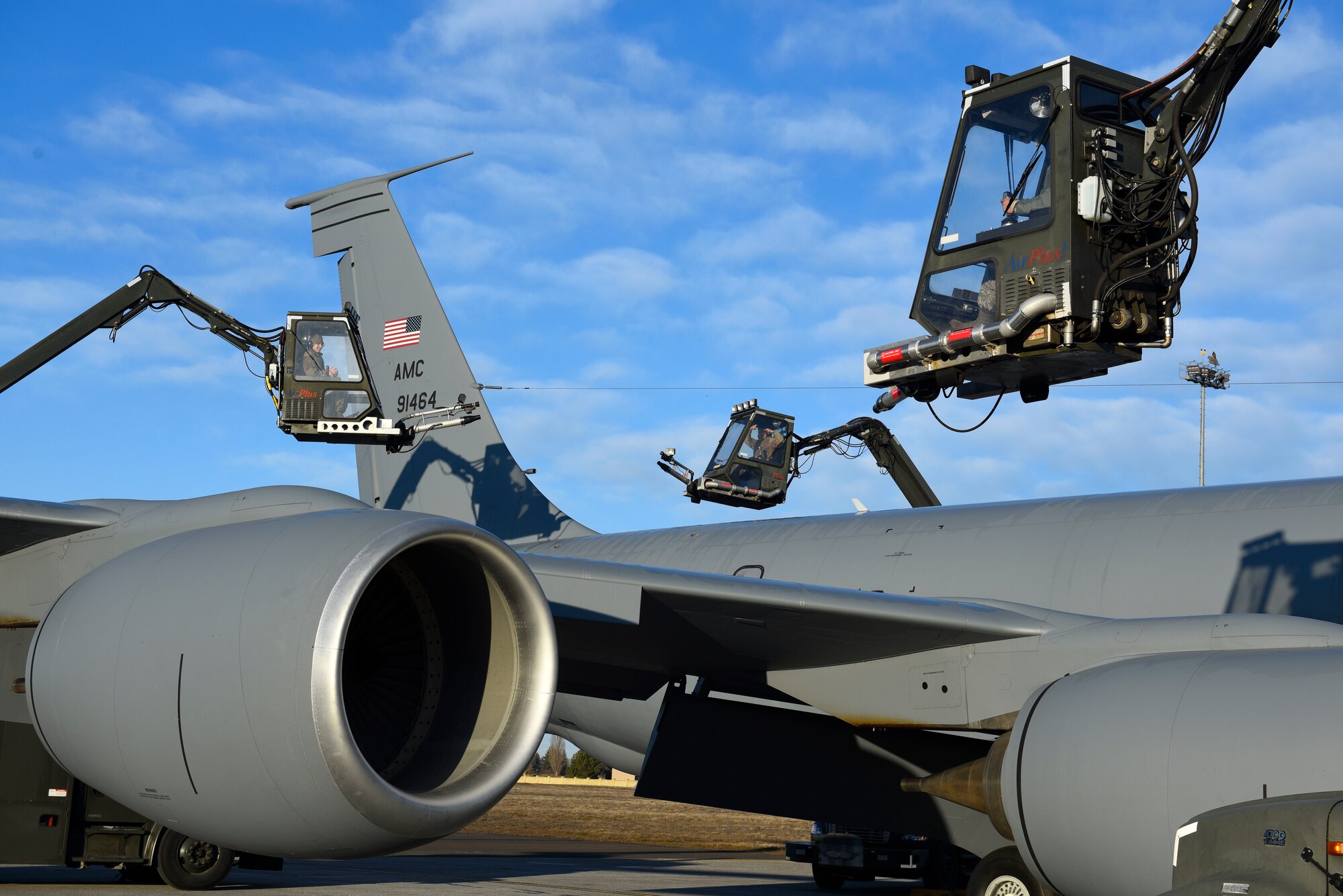 U.S. Air Force Airmen from the 92nd Maintenance and Aircraft Maintenance Squadrons prepare to deice a KC-135 Stratotanker at Fairchild Air Force Base, Washington, Feb. 27, 2020.