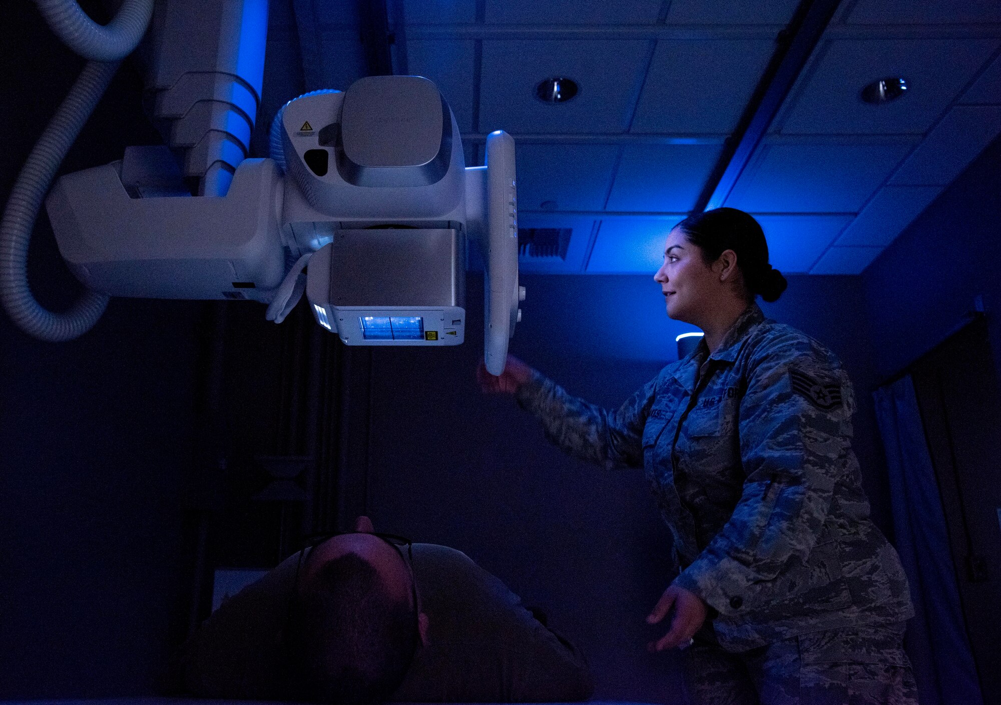 U.S. Air Force Staff Sgt. Laura Hakes, 92nd Medical Support Squadron radiology technician, takes a chest x-ray for a patient Feb. 27, 2020 at Fairchild Air Force Base, Washington.
