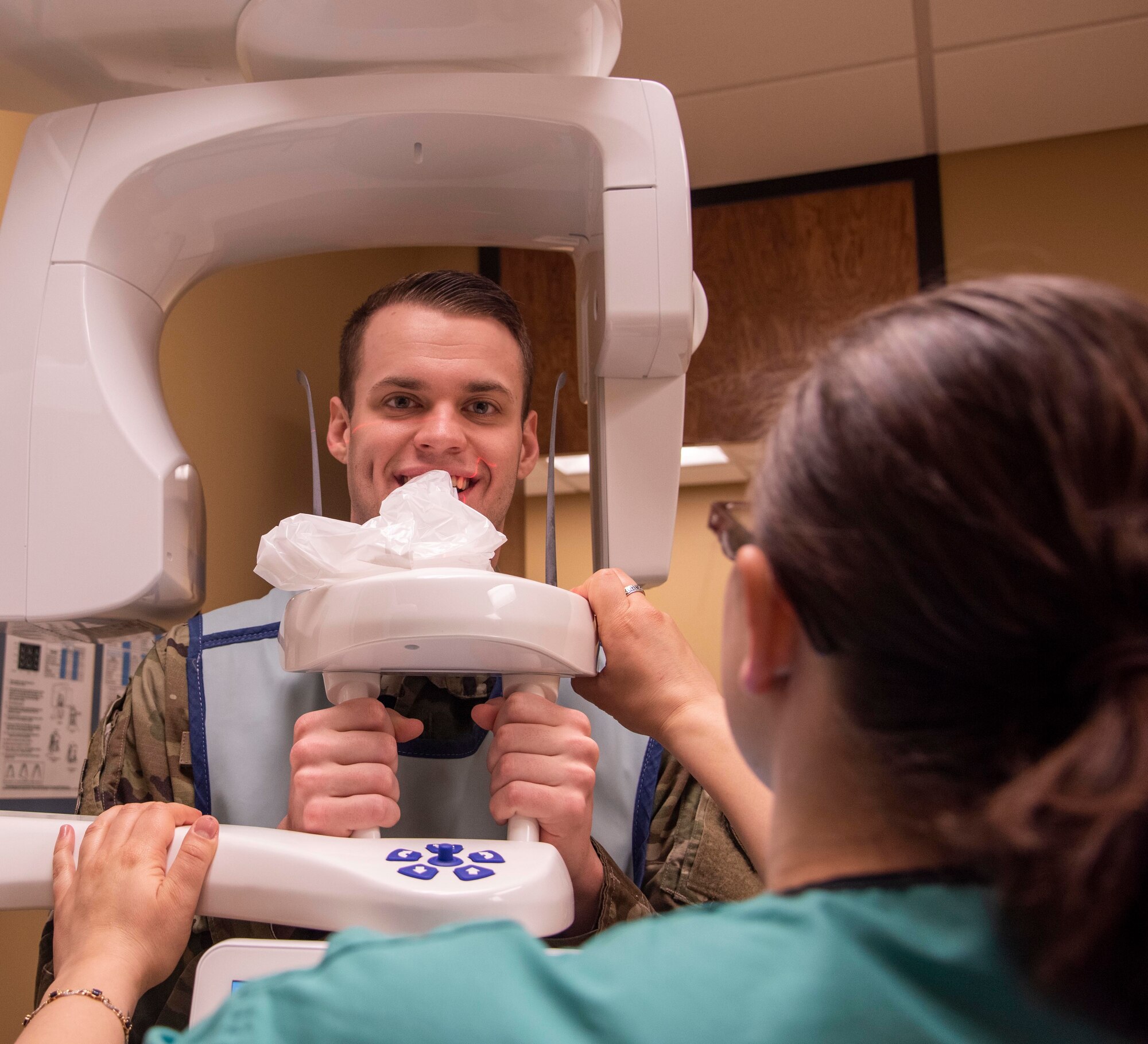U.S. Air Force Staff Sgt. Tristan Crosswhite, 92nd Aerospace Medicine Squadron dental assistant, takes dental x-rays for a patient Feb. 27, 2020 at Fairchild Air Force Base, Washington.