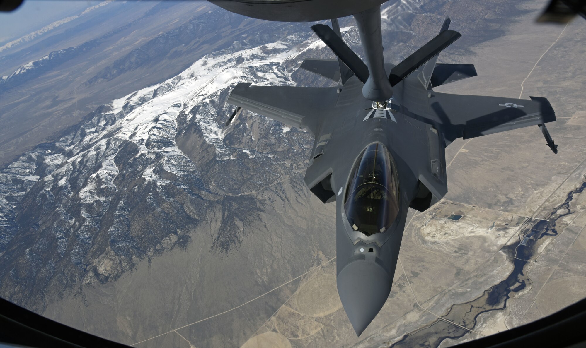 An F-35 Lightning II from Hill Air Force Base, Utah, latches on to a boom operator to receive fuel from a KC-135 Stratotanker from Fairchild Air Force Base, Washington, Feb. 27, 2020, near Hill AFB.