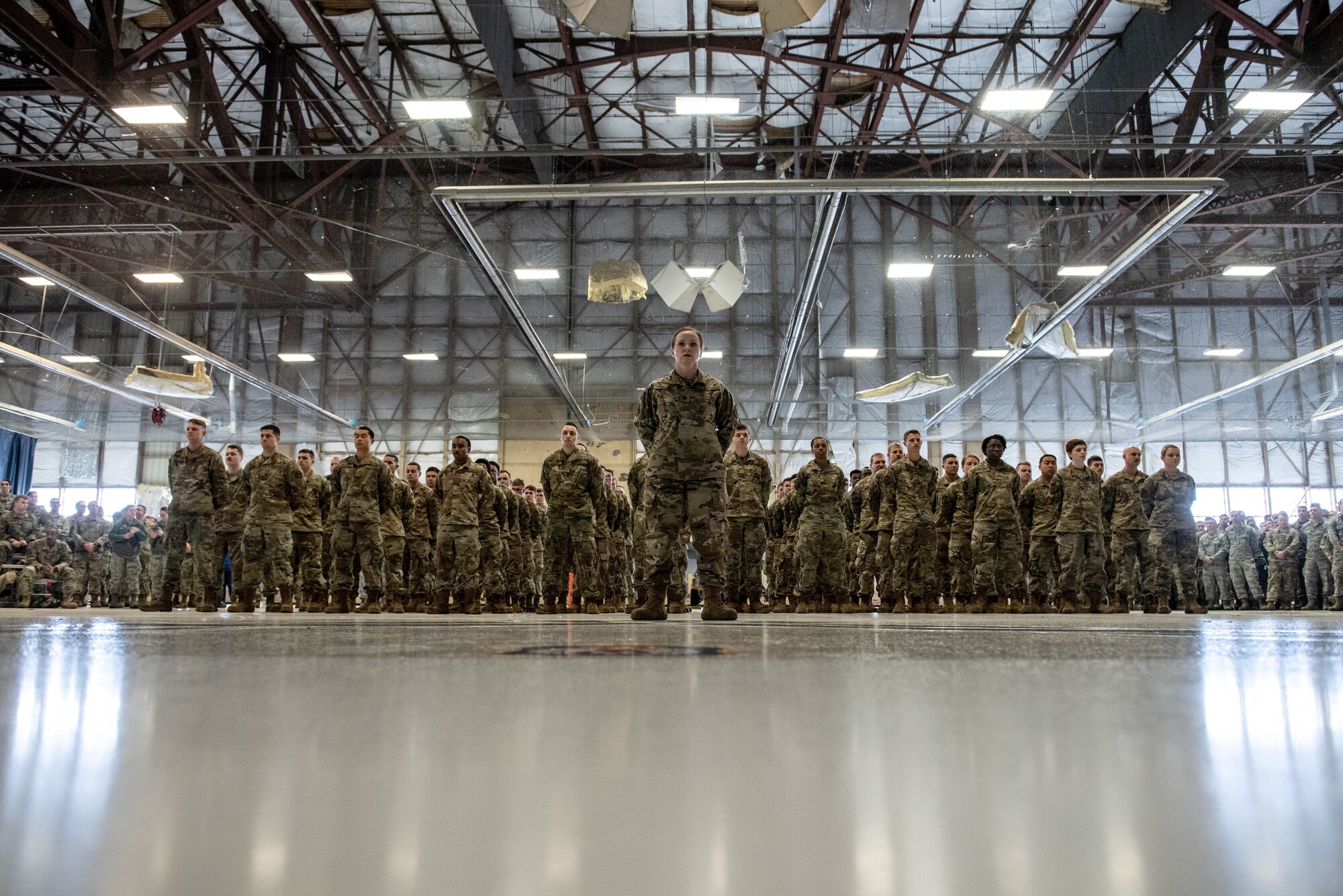 Airmen assigned to the 20th Aircraft Maintenance Squadron (AMXS) stand at parade rest awaiting the reorganization of the squadron during a squadron stand-up ceremony at Shaw Air Force Base, South Carolina, Feb. 24, 2020.