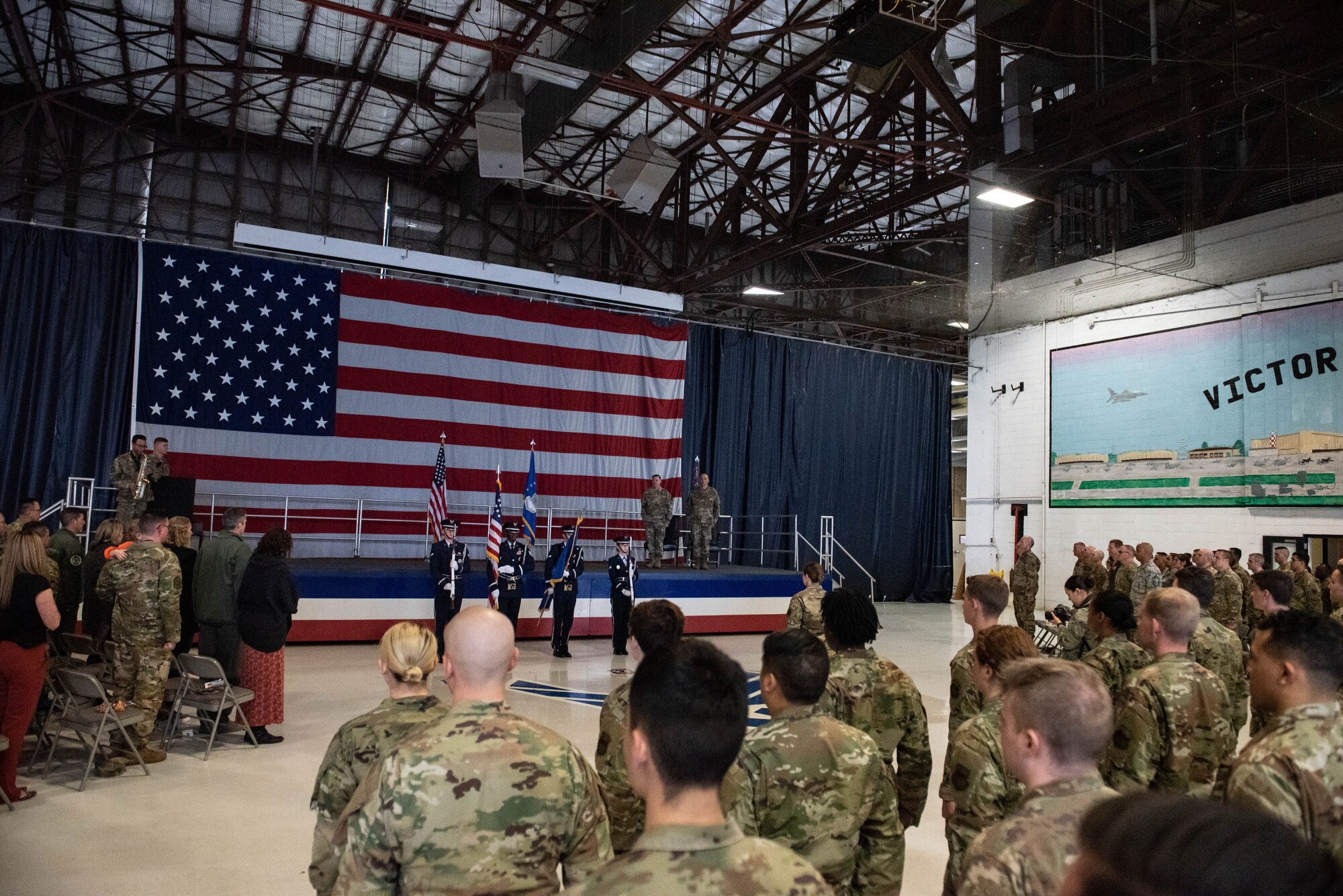 The 20th Force Support Squadron honor guard hoists the colors while the national anthem plays during a squadron stand-up ceremony at Shaw Air Force Base, South Carolina, Feb. 24, 2020.