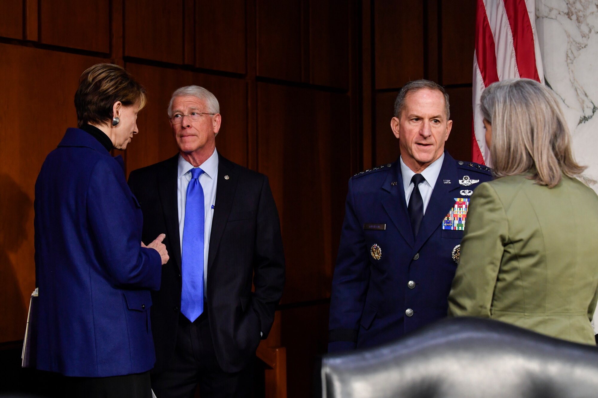 Air Force Secretary Barbara M. Barrett and Chief of Staff Gen. David L. Goldfein, second from right, speak with members of the Senate Armed Services Committee before testifying on the posture of the Air Force at the Hart Senate Office Building in Washington, D.C., March 3, 2020. (U.S. Air Force photo by Wayne Clark)