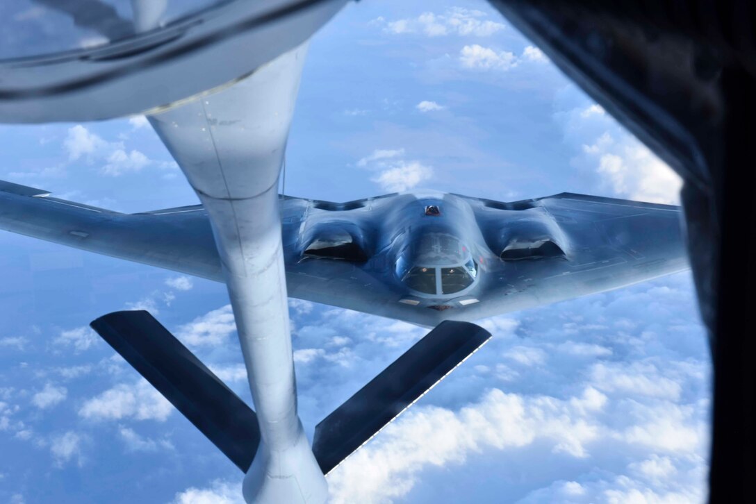 A B-2 Spirit from Whiteman Air Force Base, Missouri, is refueled by a KC-135 Stratotanker from Fairchild Air Force Base, Washington, while flying over Kansas, Feb. 24, 2020. Air refueling provides military aircraft with support to achieve the mission no matter where or when. (U.S. Air Force photo by Airman 1st Class Kiaundra Miller)