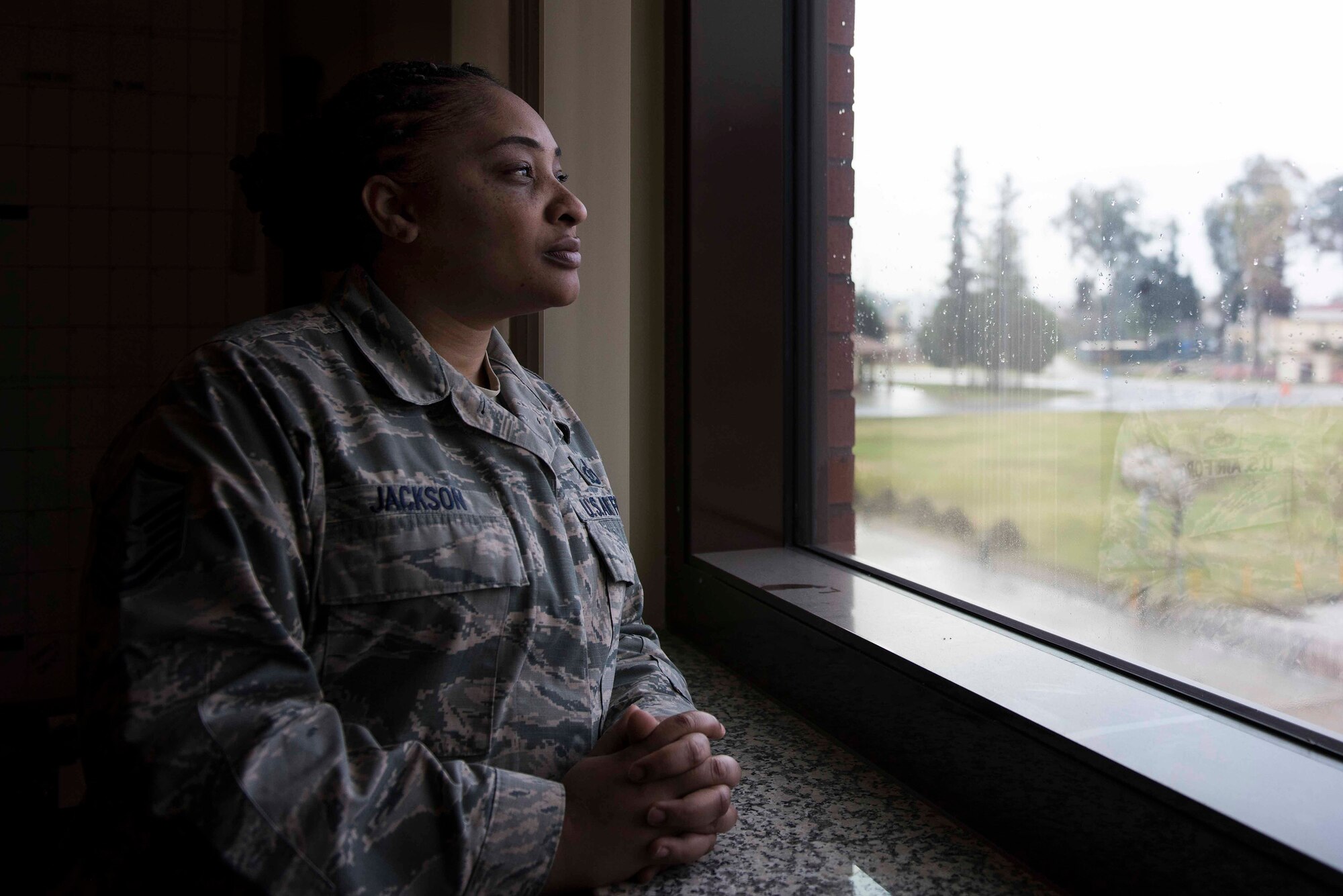 U.S. Air Force Master Sgt. Debbie Jackson, 39th Air Base Wing career assistance advisor, stares out the window of her office Feb. 21, 2020, at Incirlik Air Base, Turkey. Jackson is tasked with mentoring Airmen about their choices in regards to career advancement, professional development and retraining. (U.S. Air Force photo by Staff Sgt. Joshua Magbanua)