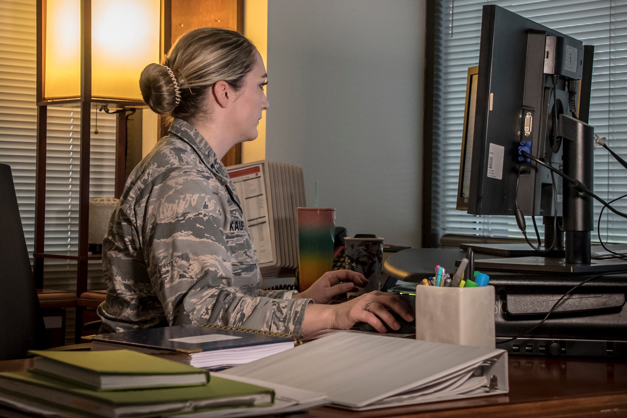 Military members view information on a computer