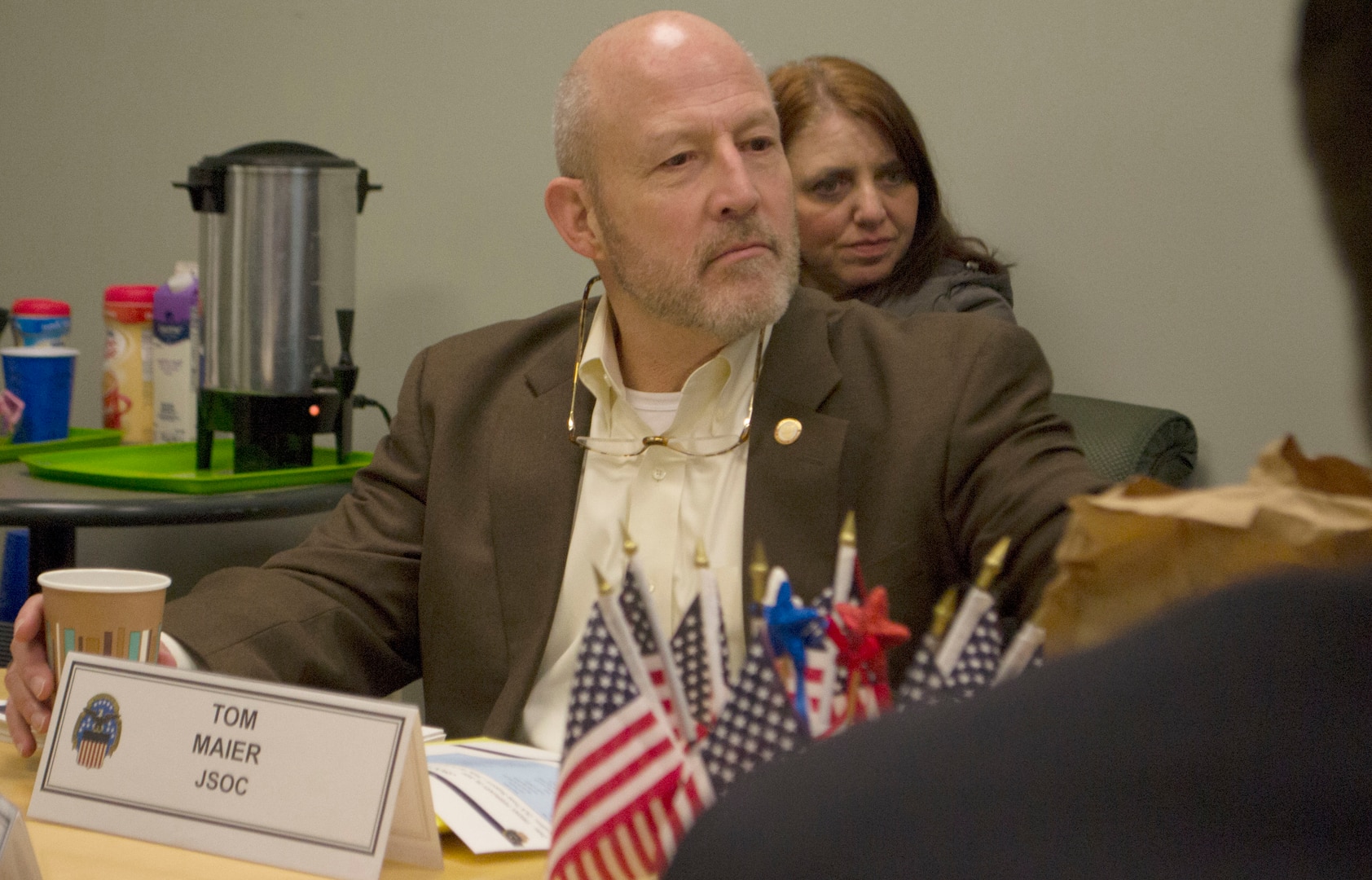 Tom Maier, a Joint Special Operations Command logistics team lead, listens to a presentation during a visit at DLA Troop Support Feb. 28, 2020 in Philadelphia.