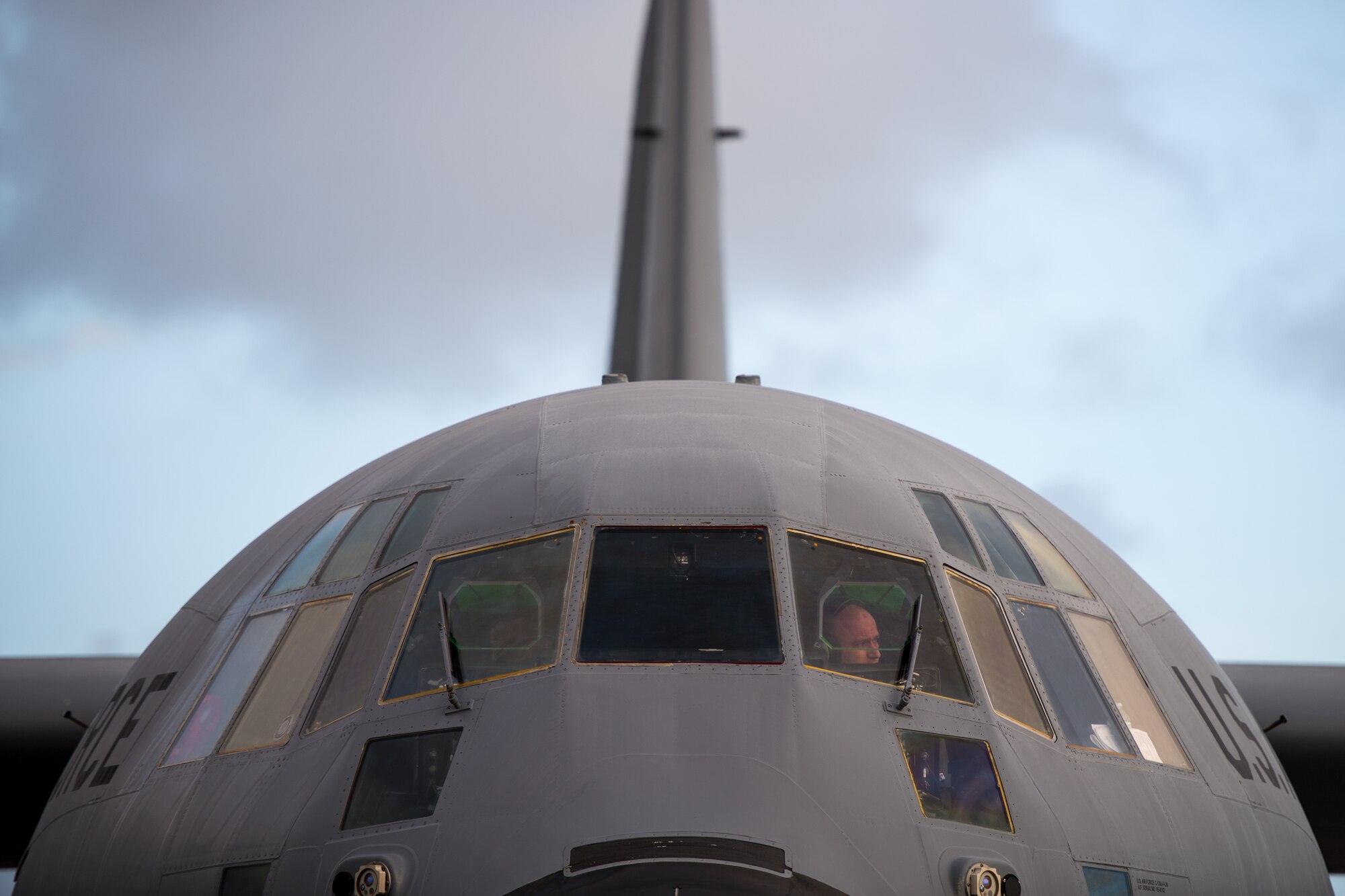 Capt. Jason Rimmer, a pilot assigned to the 815th Airlift Squadron, Keesler Air Force Base, Mississippi, prepares to fly a C-130J Super Hercules for an airdrop of Royal Australian Air Force combat controllers assigned to the 4th Squadron, Bravo flight, during Exercise Cope North 20, Feb. 14, 2020, Andersen Air Force Base, Guam. Cope North 20 is an annual trilateral field training exercise conducted at Andersen Air Force Base, Guam, and around the Commonwealth of the Northern Mariana Islands (CNMI), Palau and Yap in the Federated States of Micronesia. (U.S. Air Force photo by Senior Airman Gracie Lee)