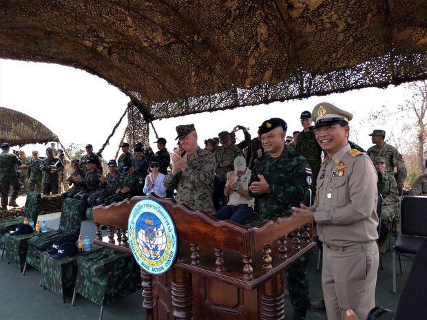 From left to right, U.S. Marine Lt. Gen. Stacy Clardy, the III Marine Expeditionary Force commanding general, Thai Army Lt. Gen. Sittipol Nimnuan, director general of the Royal Thai Armed Forces Thai Mine Action Center, and the RTAF Deputy Chief of Staff Gen. Pariphat Phalasin celebrate after detonating a group of recovered landmines at a landmine reduction event during Cobra Gold 2020 at Watthana Nakjon, Sa Kaeo, Kingdom of Thailand, March 3.
