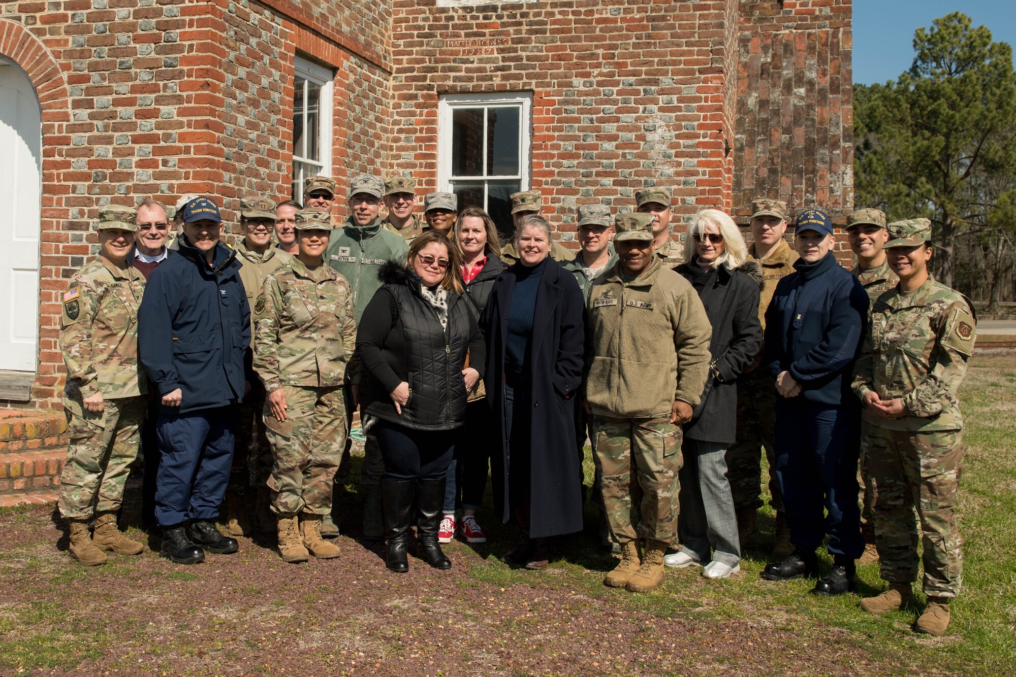 A group photo in front of the Matthew Jones House