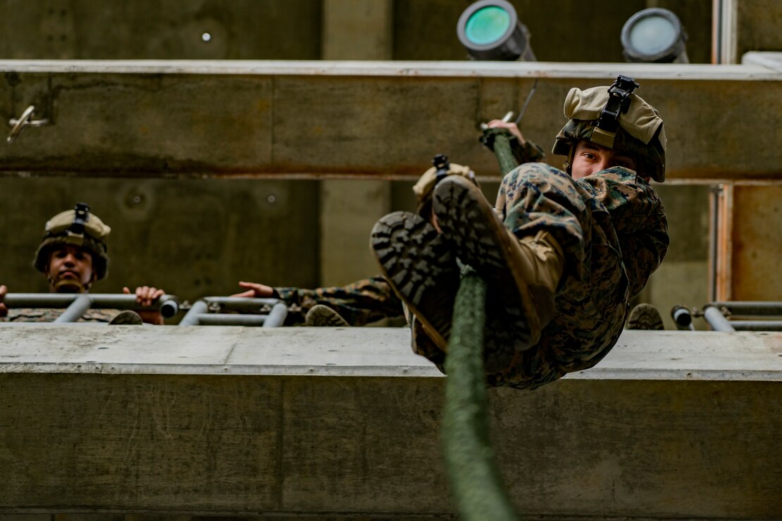 U.S. Marines fast rope during rappel tower training at Camp Schwab, Okinawa, Japan, March 3.