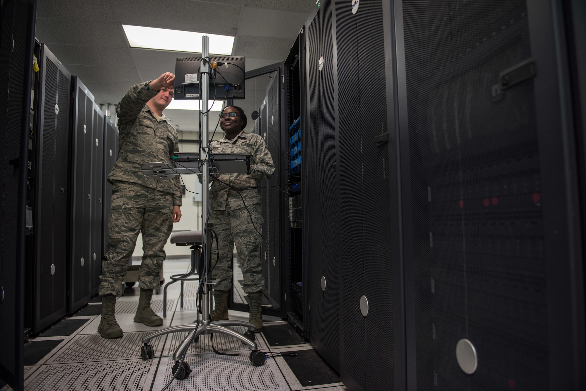 U.S. Air Force Airmen update network software.