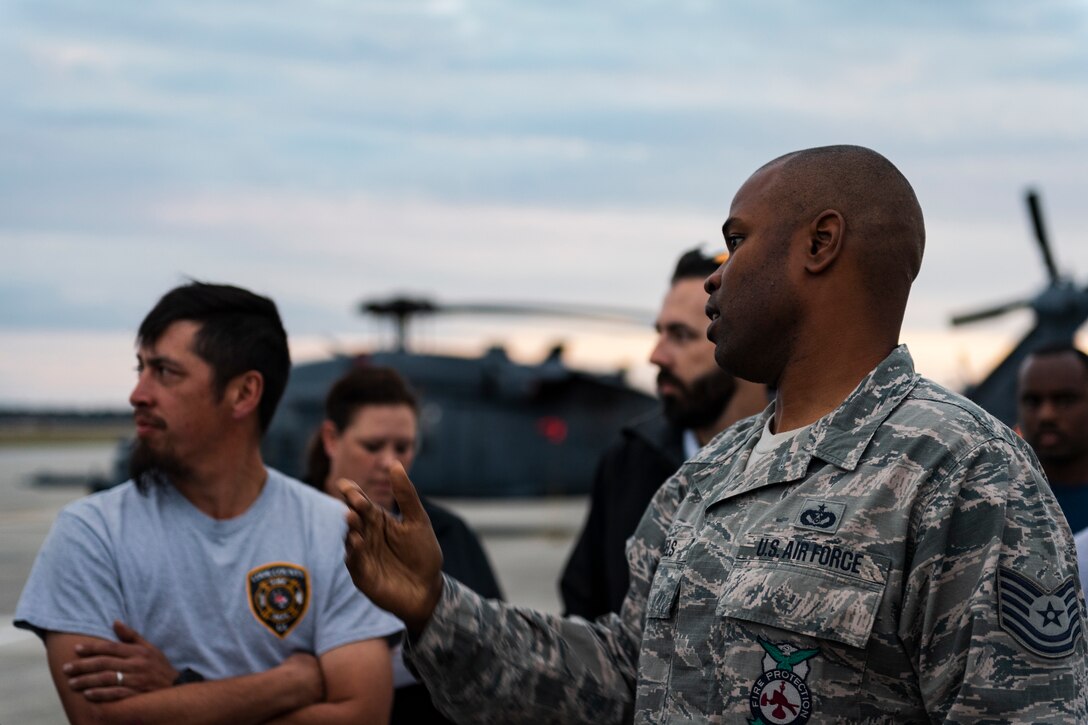 A photo of an Airman training firefighters