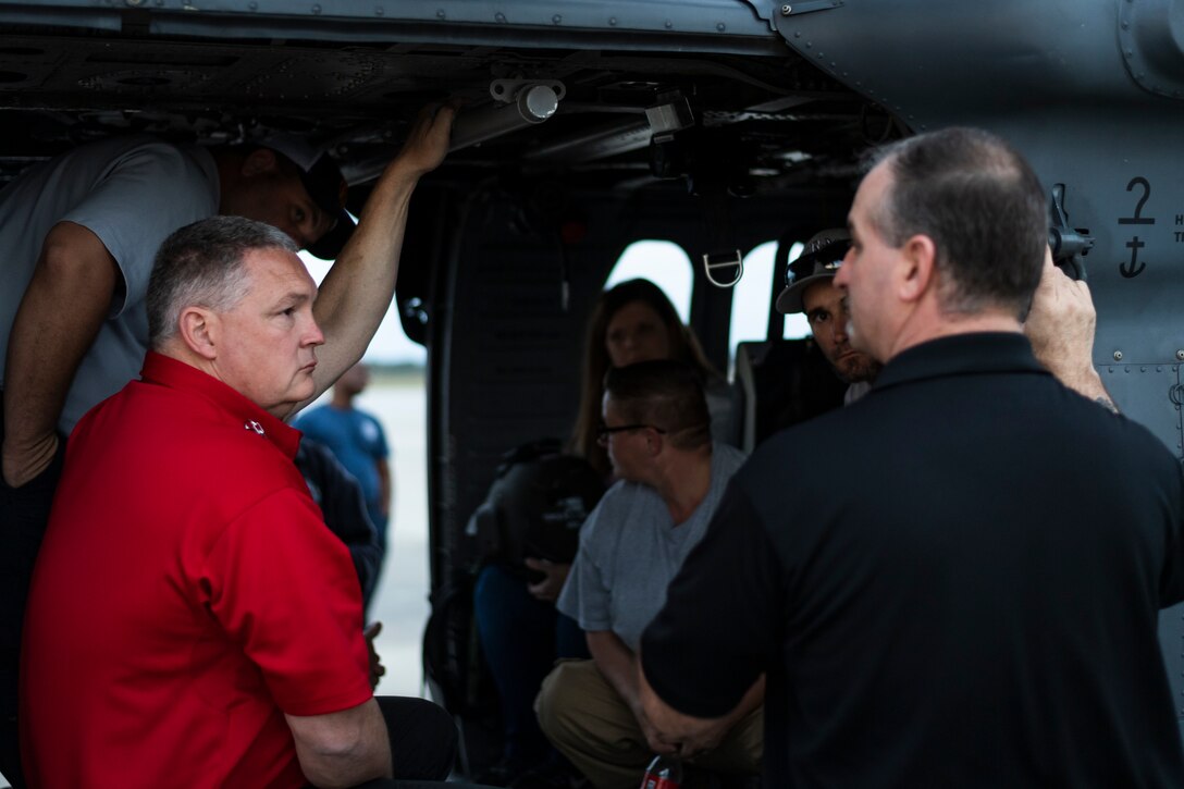 A photo of a local fire chief listening to a brief