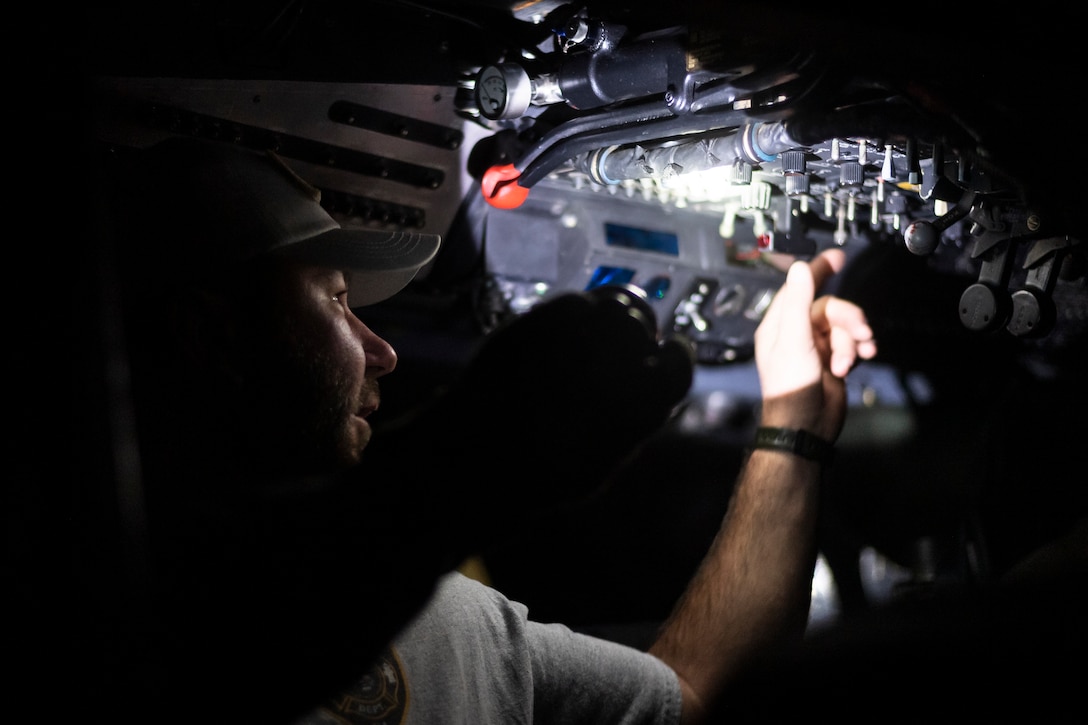 A photo of a local firefighter sitting in a helicopter