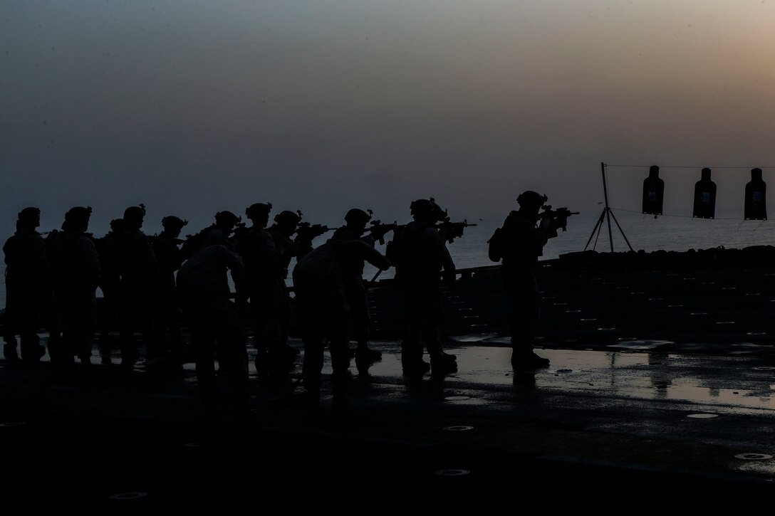 200301-M-KE756-1066 GULF OF OMAN (March 1, 2020) Marines assigned to Fox Company, Battalion Landing Team, 2nd Battalion, 8th Marine Regiment, 26th Marine Expeditionary Unit (MEU), fire M4A1 carbines during a live-fire training range aboard the amphibious assault ship USS Bataan (LHD 5) March 1, 2020. Bataan, with embarked 26th MEU, is deployed to the U.S. 5th Fleet area of operations in support of naval operations to ensure maritime stability and security in the Central Region, connecting the Mediterranean and Pacific through the Western Indian Ocean and three strategic choke points. (U.S. Marine Corps photo by Cpl. Tanner Seims)