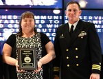 IMAGE: Sue Limerick is the Naval Surface Warfare Center Dahlgren Division featured employee for Women's History. Limerick is pictured with Capt. Plew during the honorary awards ceremony in May 2019.