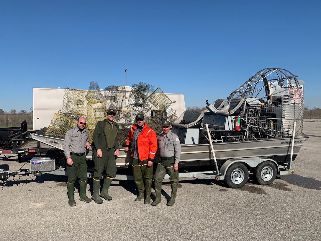 Houston Project Office Rangers, Grant Foote, Andrew Cook, Eric Angle and Mark Tyson, participated in an abandoned crab trap removal at the Wallisville Lake Project. A total of 25 abandoned crab traps were removed from the Project's waters. Abandoned crab traps have been found to be a significant source of entrapment for a variety of aquatic species as well as a source of costly repairs for boaters whose motors can become entangled in the wire mesh traps.