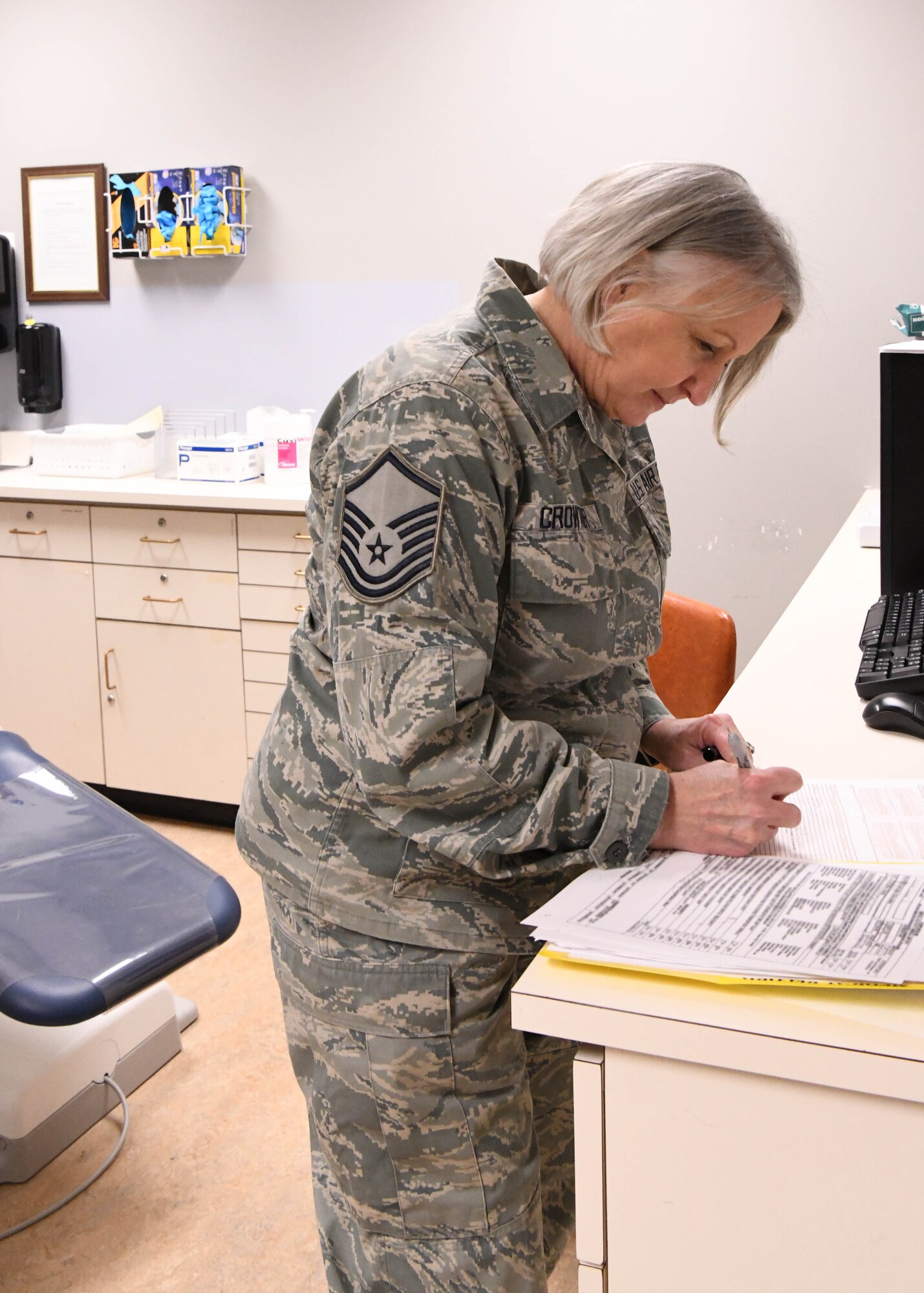 Master Sgt. Terrylee Crowther, 104th FW Dental Assistant keeps medical paperwork and records for Airmen. As the NCOIC of Dental at the 104th Fighter Wing, she ensures members are up to date on dental screenings so they can stay deployment ready. (U.S. Air National Guard Photo by Airman Camille Lienau)