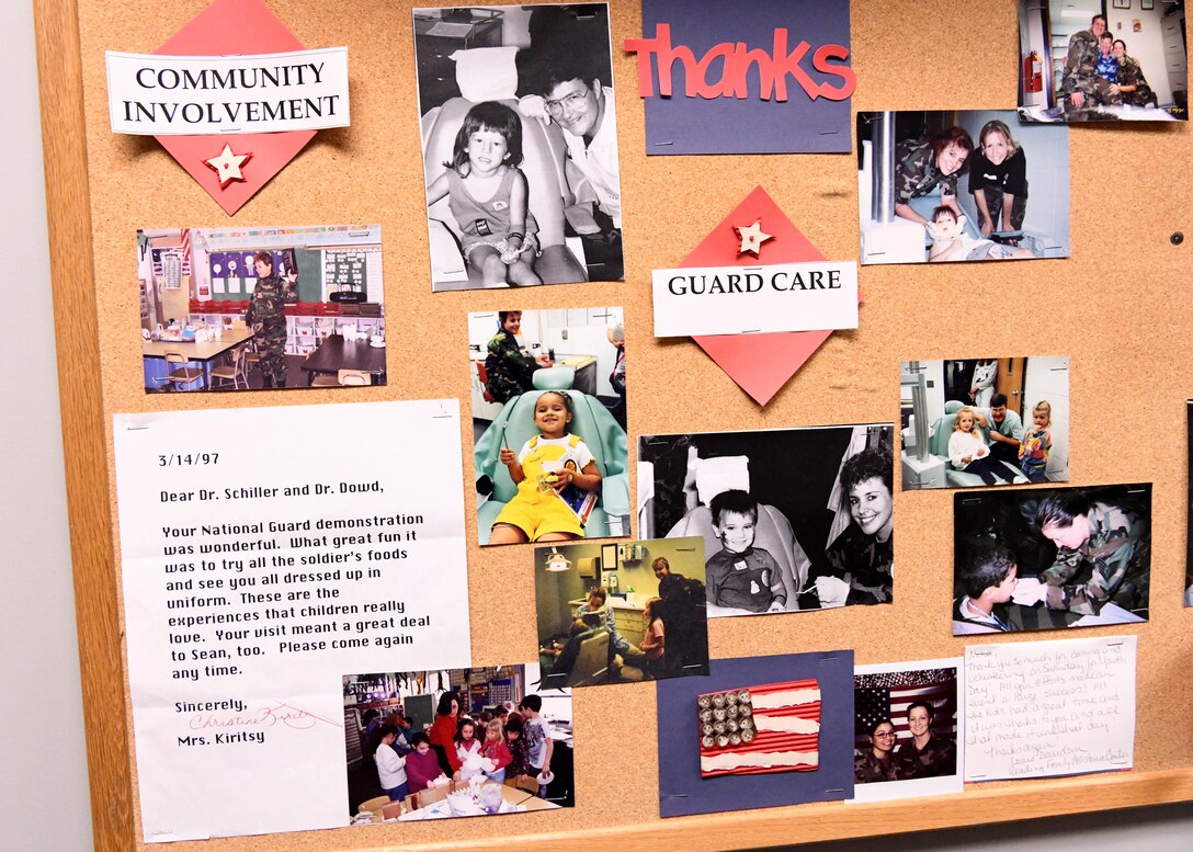 Master Sgt. Terrylee Crowther, 104th FW Dental Assistant decorates her office with pictures from her career. As the NCOIC of Dental at the 104th Fighter Wing, she ensures members are up to date on dental screenings so they can stay deployment ready. (U.S. Air National Guard Photo by Airman Camille Lienau)