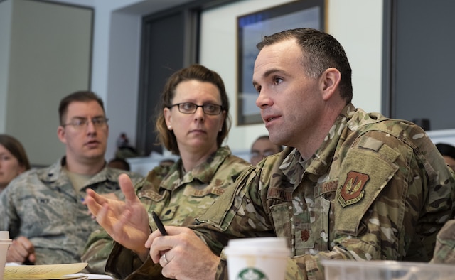 U.S. Air Force Maj. Jason Mitchell, 52nd Mental Health Flight commander, discusses various topics through each scenario during the 52nd Medical Group table-top exercise at Spangdahlem Air Base, Germany, Feb. 26, 2020. The topics examined where the check-in process, possible work flow challenges, understanding host-nation requirements, testing for the virus and what processes will be implemented when there is a positive result through different scenarios. (U.S. Air Force photo by Airman 1st Class Branden Rae)