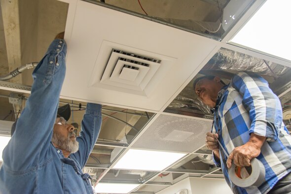 Contractors working on the Child Development Center kitchen renovation install a vent at Laughlin Air Force Base, Texas, March 3, 2020. The new renovation comes with an expanded workspace, new cabinets and appliances, and more ease of use for the faculty.