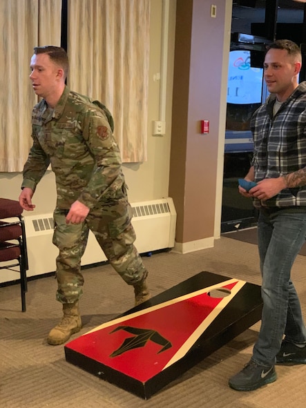 Members of the 104th Fighter Wing took part in the 104th Fighter Wing’s Enlisted vs. Officers Olympics, Feb. 1, 2020. Airmen of all ranks participated in a friendly competition of darts, shuffleboard, corn hole, foosball, giant Jenga, flip cup, and pool to bring the wing’s team members together for camaraderie. (U.S. Air National Guard photo by Senior Master Sgt. Julie Avey)