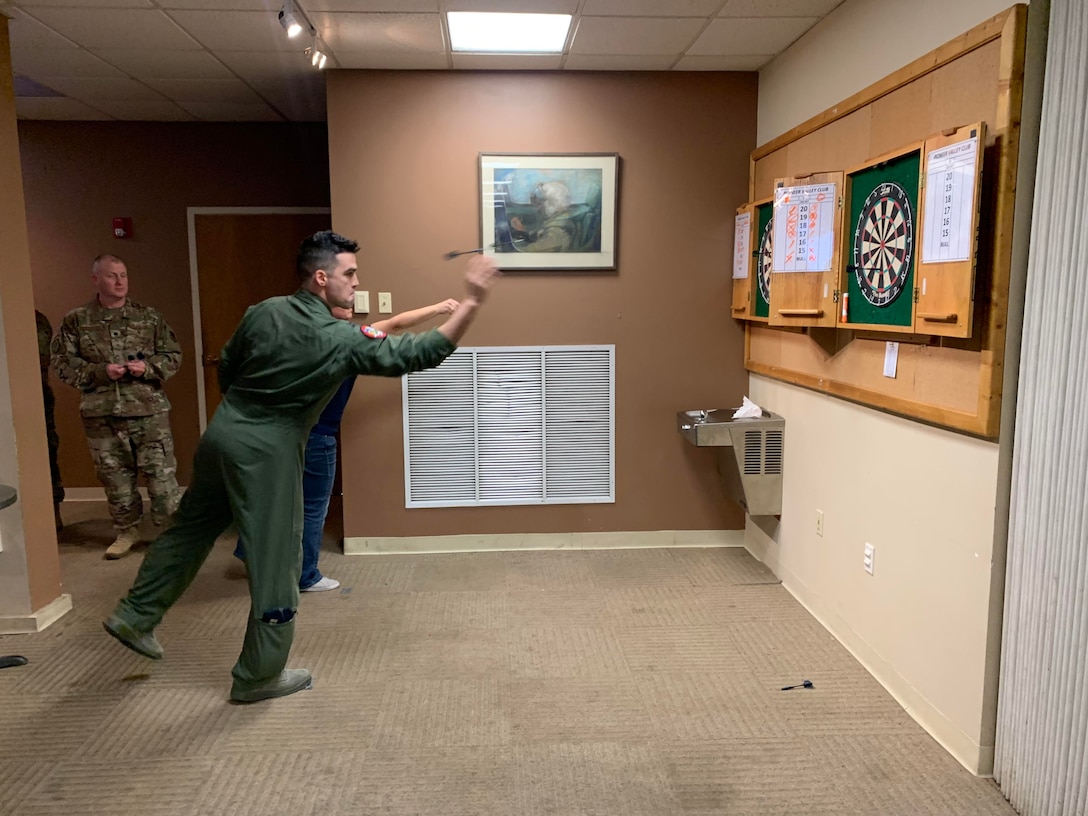 Members of the 104th Fighter Wing took part in the 104th Fighter Wing’s Enlisted vs. Officers Olympics, Feb. 1, 2020. Airmen of all ranks participated in a friendly competition of darts, shuffleboard, corn hole, foosball, giant Jenga, flip cup, and pool to bring the wing’s team members together for camaraderie. (U.S. Air National Guard photo by Senior Master Sgt. Julie Avey)