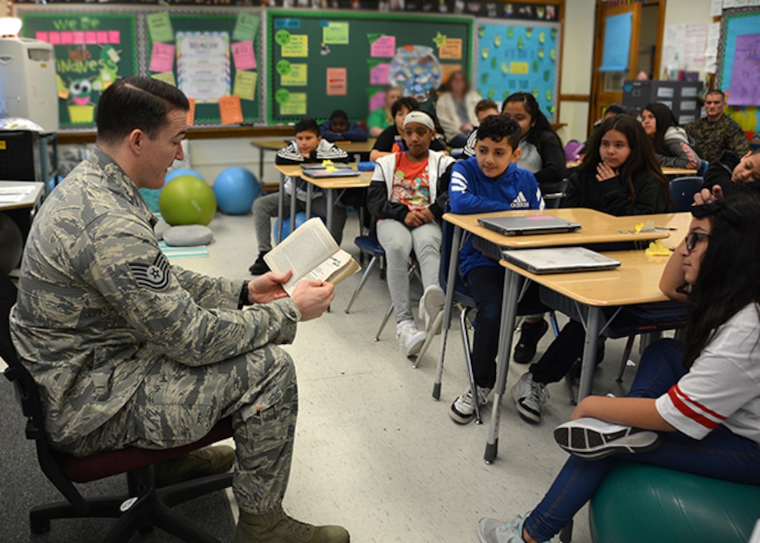 DLA Aviation military member reads to elementary school students