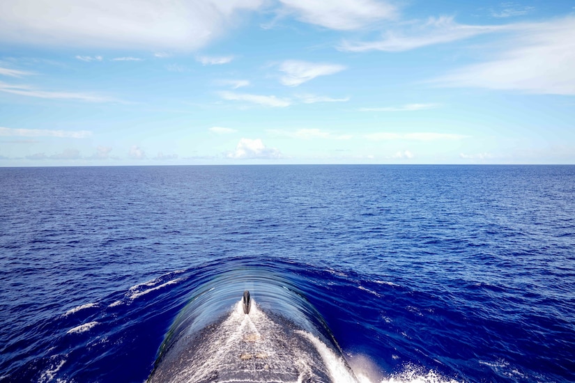 A submarine emerges from the water.