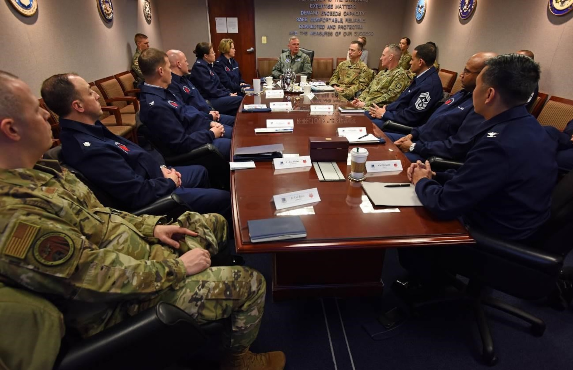 Members of the 89th Airlift Wing brief Maj. Gen. Ricky N. Rupp, Air Force District of Washington and 320th Air Expeditionary Wing commander, middle, on the wing’s various functions during an 89th AW Immersion Tour on Joint Base Andrews, Maryland, Feb. 28, 2020. During the tour, Rupp, and other AFDW and 11th Wing leaders received a wing mission briefing, visited the wing’s communication and aerial port squadrons, and a toured a C-32A aircraft. (U.S. Air Force photo by Tech. Sgt. Kentavist P. Brackin)