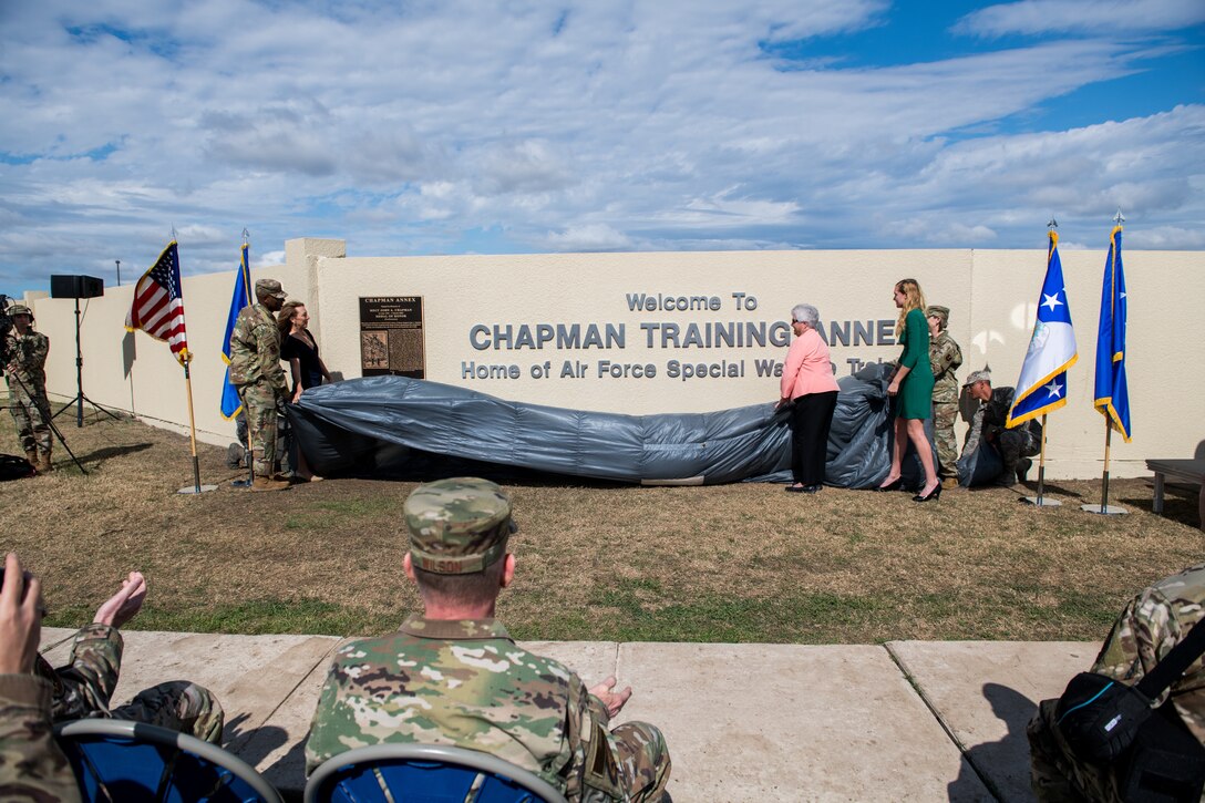 Chief Master Sgt. of the Air Force Kaleth O. Wright (left) and Chief Master Sgt. Julie Gudgel (right), along with the family of Master Sgt. John A. Chapman (center), reveal the new sign during the Joint Base San Antonio Annex renaming ceremony, March 4, 2020