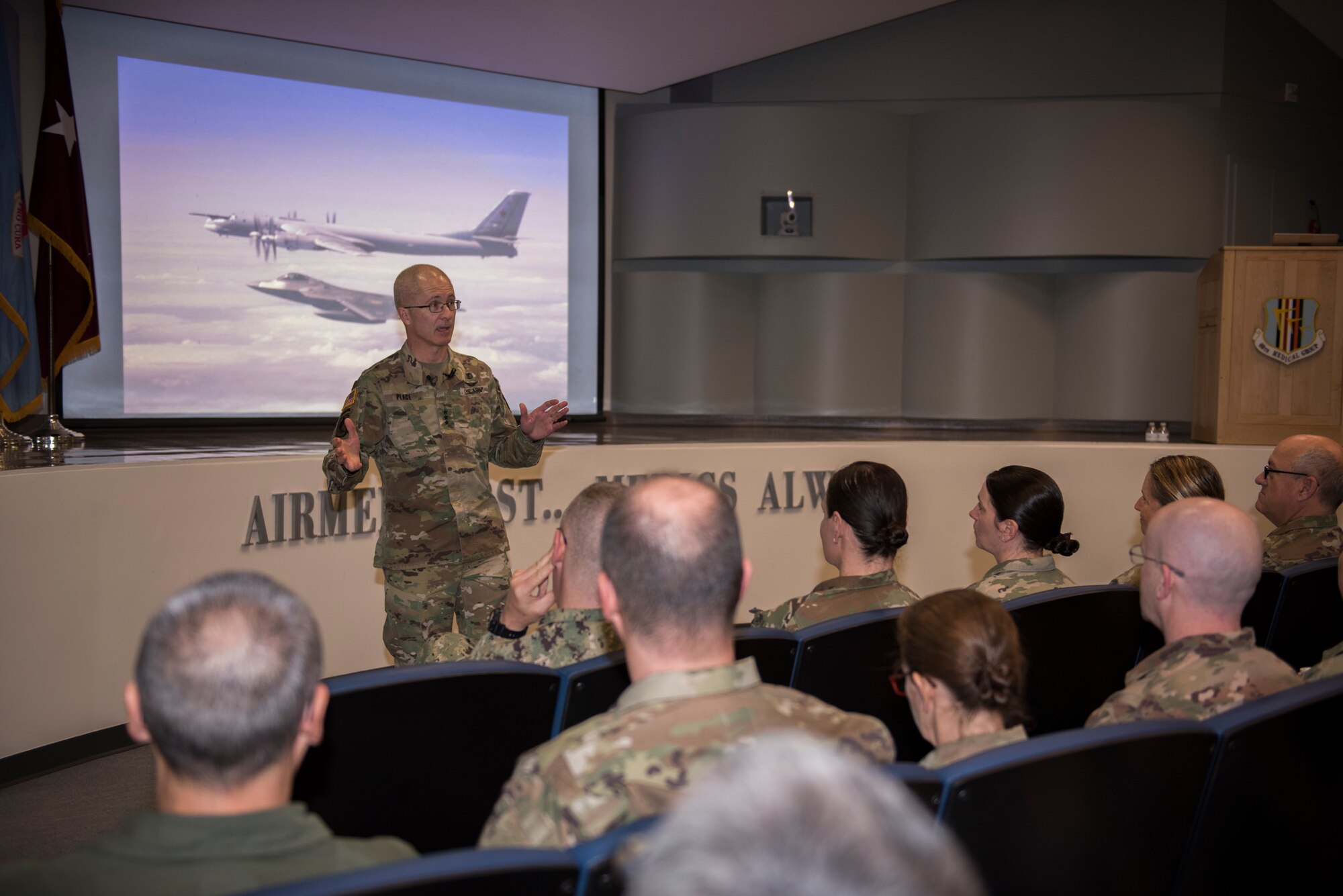 U.S. Army Lt. Gen. Ronald J. Place, Defense Health Agency director, speaks to David Grant USAF Medical Center personnel during a town hall meeting Feb. 27, 2020, at Travis Air Force Base, California. During the town hall, Place discussed the connection between having a medically ready force, a ready medical force, satisfied patients and a fulfilled staff. (U.S. Air Force photo by Airman 1st Class Cameron Otte)