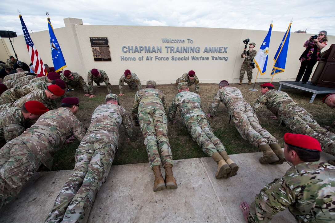 U.S. Airmen participate in the memorial pushups during the Chapman Training Annex renaming ceremony, March 4, 2020, at Joint Base San Antonio-Chapman Training Annex, Texas.